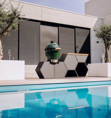 Swimming pool with the 'Less is More' outdoor kitchen from HIVE Kitchens