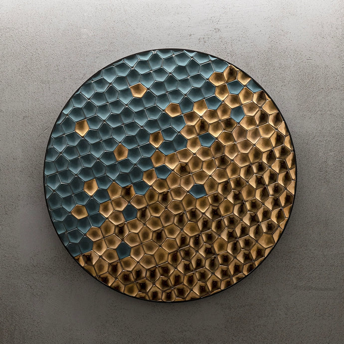 Concrete wall with round surface filled with blue and gold Botteganove Petali tiles